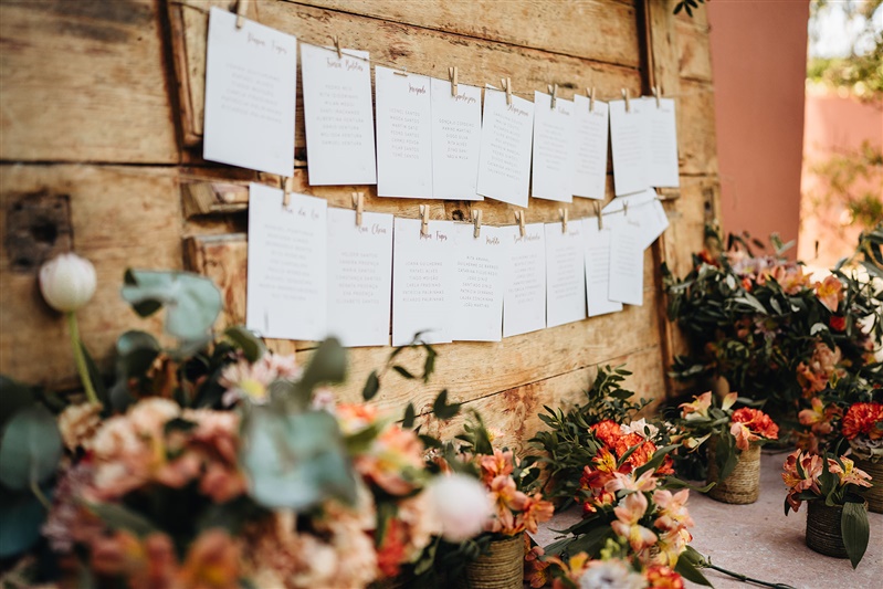 Wedding seating chart with floral arrangements at a destination wedding in Portugal.