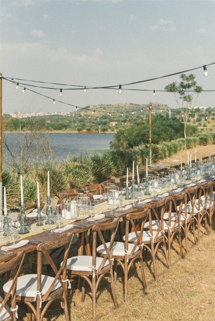 Outdoor wedding dinner table in Alentejo at a private estate with long table setting and countryside views