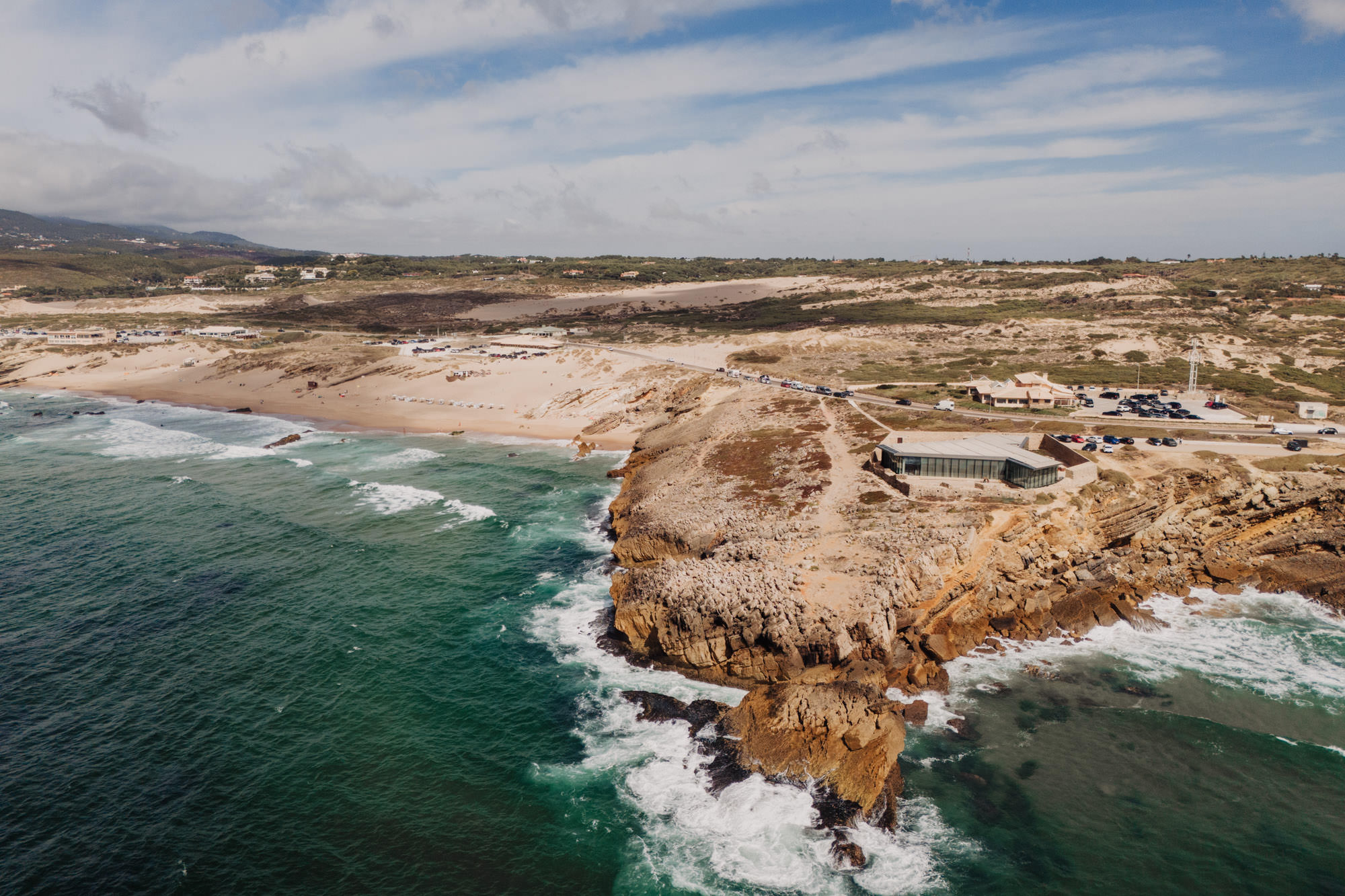 Aerial view of Cascais coastline with ocean cliffs and wedding venue by the Atlantic in Portugal