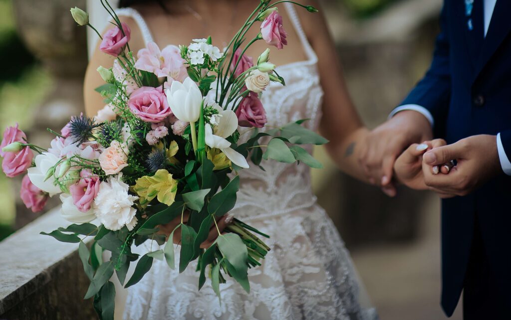 Bride holding a floral bouquet during a destination wedding in Portugal