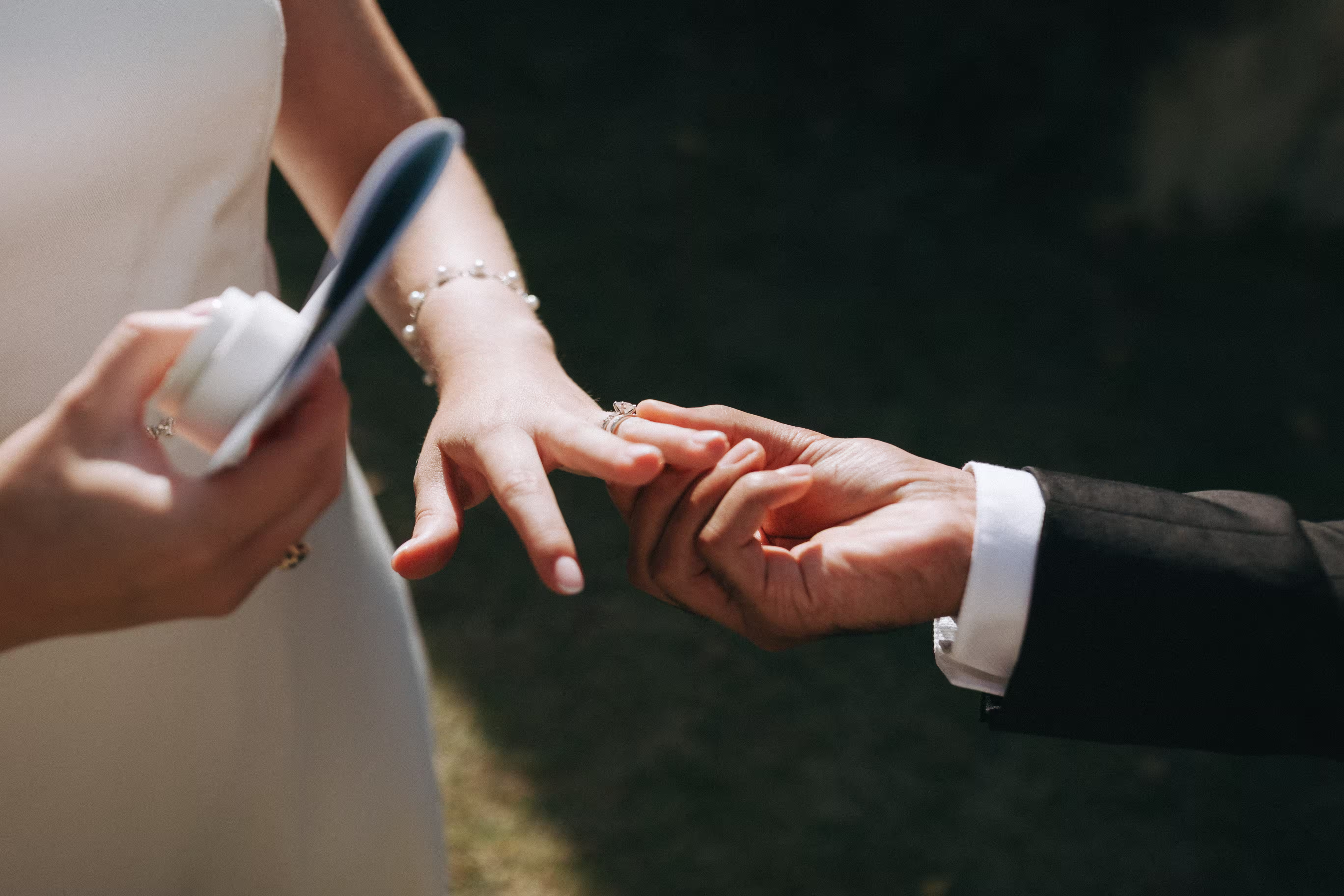 Bride and groom exchanging rings during an intimate destination wedding ceremony in Portugal