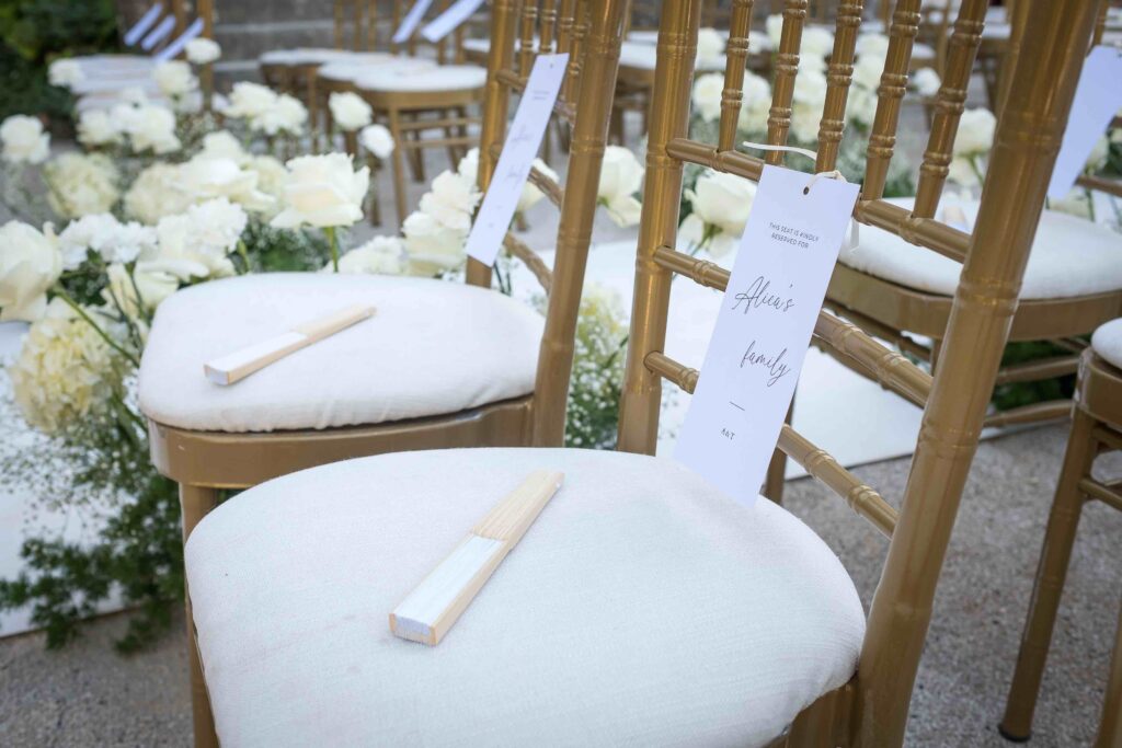 Ceremony seating and floral details at a wedding at Forte da Cruz in Estoril, Portugal