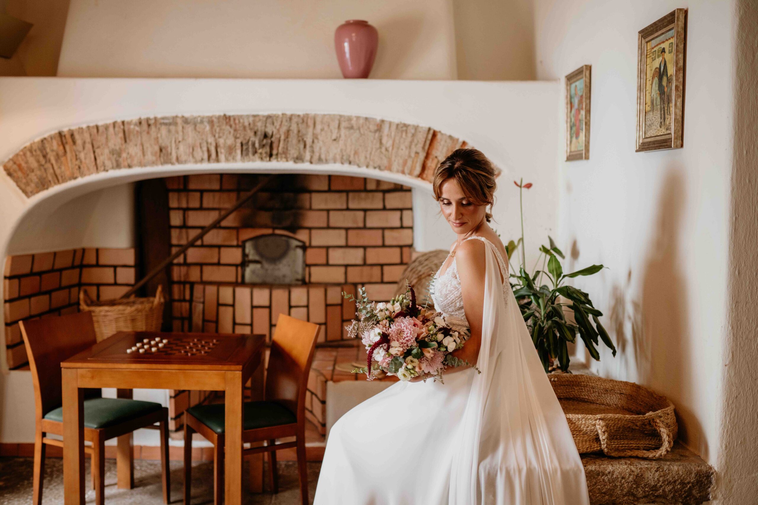 Bride getting ready for a destination wedding in Portugal inside a historic venue.