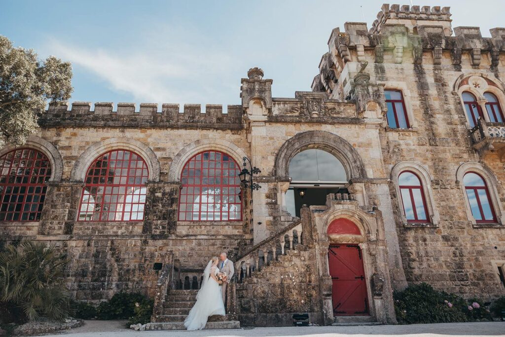 Couple outside a historic wedding venue in Portugal during a destination wedding planned by Name It Weddings & Events.
