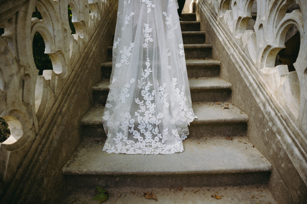 Bride on the stone staircase at Monserrate Palace in Sintra
