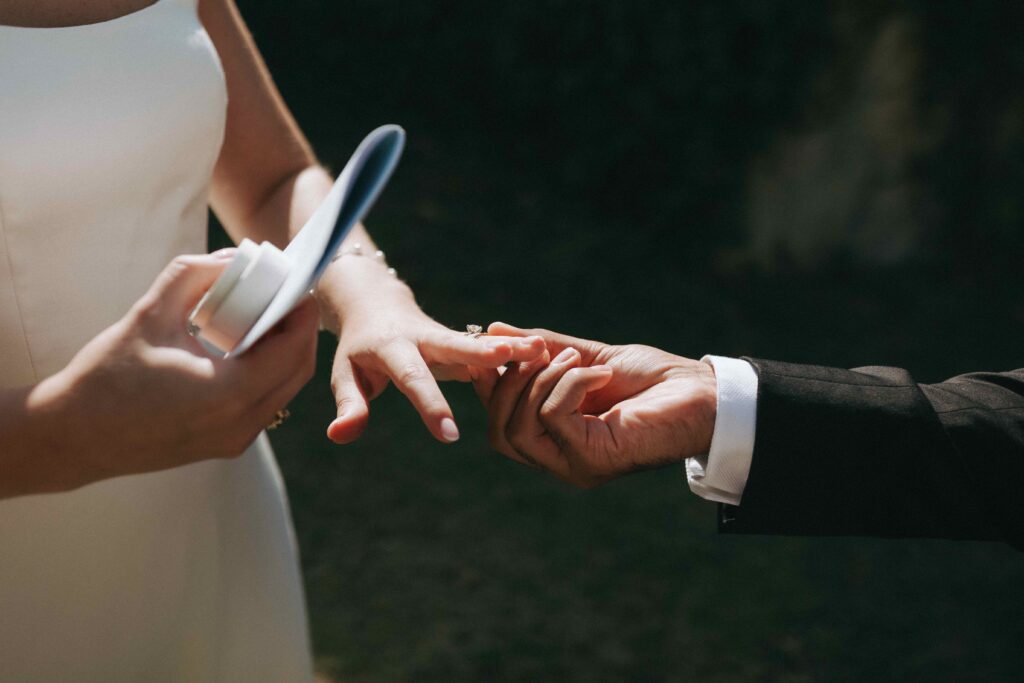 Bride and groom exchanging rings at a wedding in Portugal