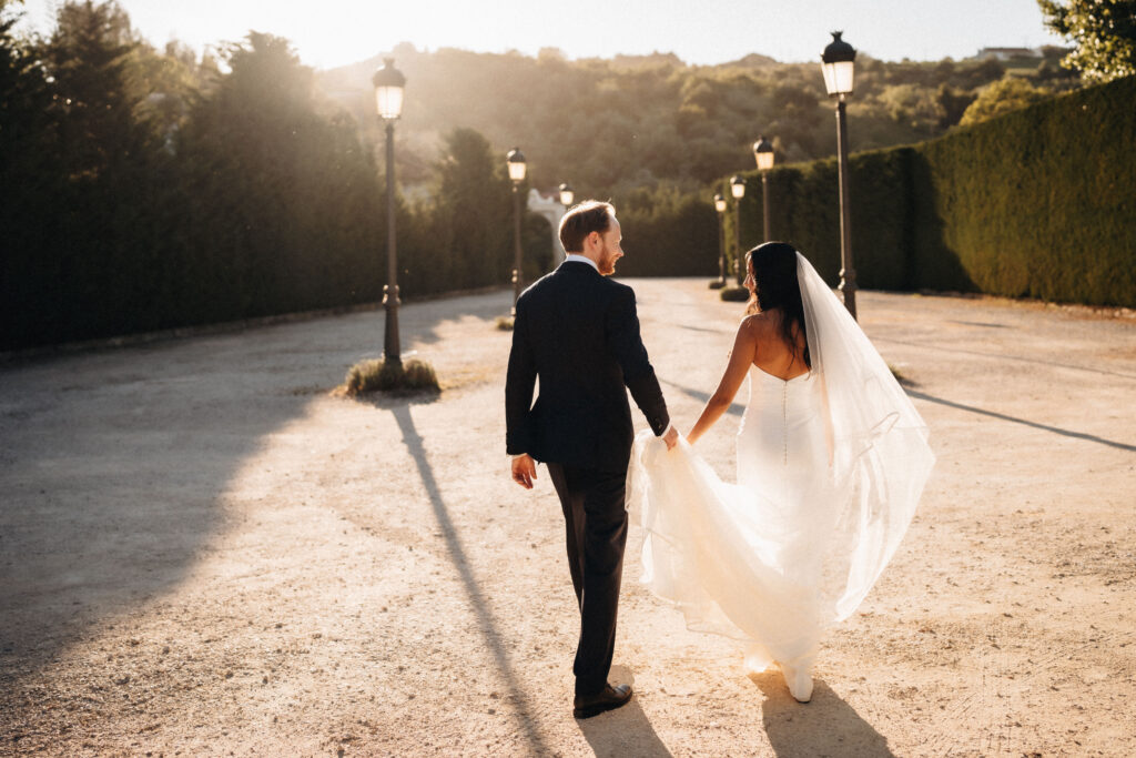 Bride and groom walking together after their wedding ceremony in Portugal
